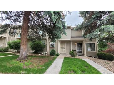 Inviting townhouse with well-maintained lawn and mature trees at 1818 S Quebec Way # 5-7, Denver, CO 80231