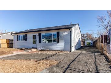 Charming single-story home featuring white siding and a well-maintained front yard with room for parking at 7856 Ladore St, Commerce City, CO 80022