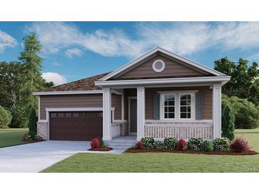 Charming single-story home with brown siding, white trim, and a well-manicured front lawn at 1353 Lumber Ridge S Cir, Erie, CO 80516