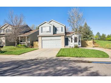 Charming two-story home with fresh green lawn and well-maintained landscaping at 2905 E Yarrow Cir, Superior, CO 80027