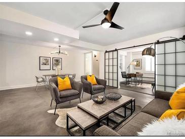 Bright living room with modern furniture and stylish decor at 99 S Downing St # B2, Denver, CO 80209