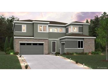 Inviting two-story home featuring stone accents and a spacious two-car garage at 2512 Lupton Ln, Lafayette, CO 80026