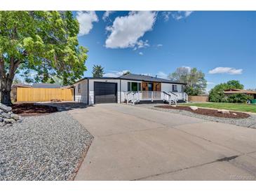 Charming one-story home featuring a spacious driveway and well-maintained front yard at 7826 Joan Dr, Denver, CO 80221