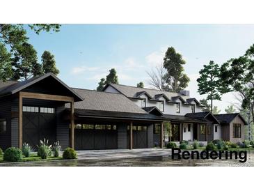 Craftsman style home with a three-car garage and landscaping at 28450 E 159Th Ave, Brighton, CO 80603
