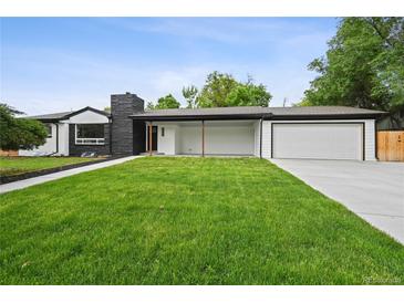 Charming single-story home featuring an attached garage, inviting front porch, and well-maintained lawn at 290 Beryl Way, Broomfield, CO 80020