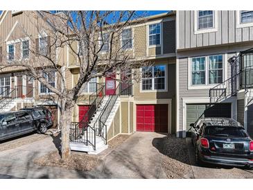 Charming townhome featuring a two-story layout and convenient attached garages at 1811 S Quebec Way # 187, Denver, CO 80231