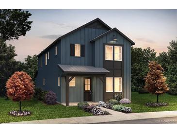 Charming two-story home with a covered porch, black trim, blue siding, and manicured landscaping at 8639 Hotchkiss St, Littleton, CO 80125