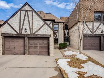 Charming townhomes featuring Tudor-style architecture and attached garages in a well-maintained community at 4250 S Olive St # 108, Denver, CO 80237