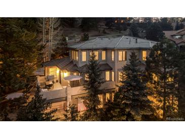 Stunning two-story home featuring a spacious deck and mountain views at 22419 Springflower Dr, Golden, CO 80401