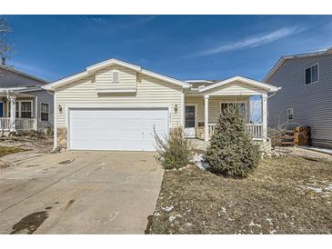 Charming single-Gathering home with a two-car garage and well-maintained front yard at 9617 Bighorn Way, Littleton, CO 80125