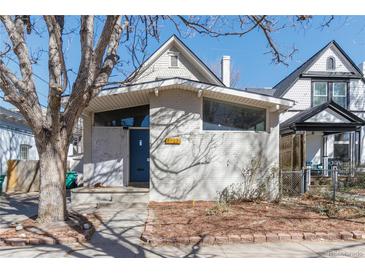 Charming home featuring a light brick facade, bright windows, and inviting front entrance, perfect for curb appeal at 1723 E 16Th Ave, Denver, CO 80218