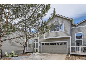Inviting two-story townhome with a gray-beige exterior, an attached garage, and a landscaped yard at 3228 47Th, Boulder, CO 80301