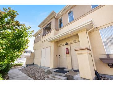 Inviting townhouse exterior features updated front entrance, stone accents and easy access with walkway and stairs at 847 E 98Th Ave # 1806, Thornton, CO 80229