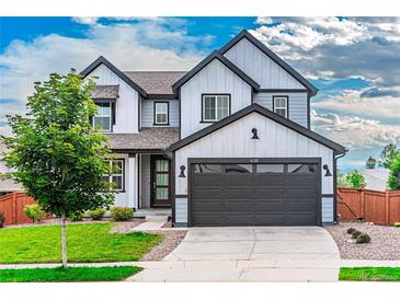 Charming two-story home with a well-manicured lawn and a modern two-car garage at 638 W 175Th Ave, Broomfield, CO 80023