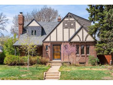 Charming brick home with landscaped front yard and well-maintained exterior at 2285 N Monaco Pkwy, Denver, CO 80207