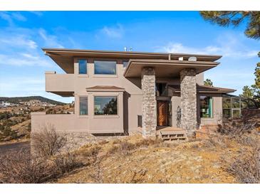 Stunning two-story home featuring stone accents and a covered front entry on a beautiful property at 457 Buena Vista Rd, Golden, CO 80401