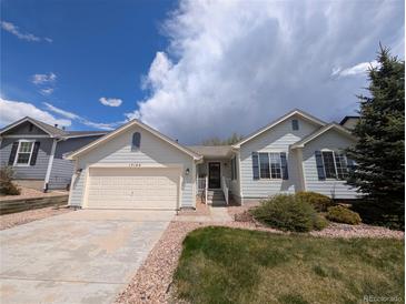 Charming single-Gathering home with well-maintained front yard and attached two-car garage in a quiet neighborhood at 17145 Park Trail Dr, Monument, CO 80132
