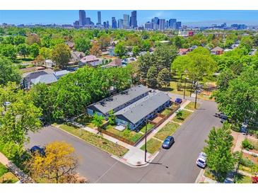 Aerial view of the property in a residential neighborhood, with downtown in the background at 2955 N Gilpin St, Denver, CO 80205