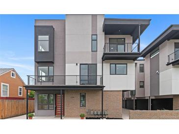 Contemporary three-story home showcasing modern design with balconies and a brick facade at 1284 Tennyson St # 1, Denver, CO 80204