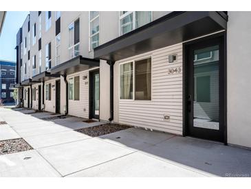 Modern townhouse exteriors featuring clean lines, black accents, and well-maintained landscaping at 3043 W 19Th Ave, Denver, CO 80204