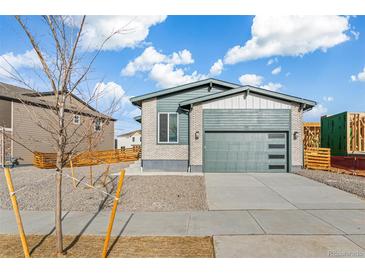 Charming single-Gathering home featuring a two-car garage and attractive exterior paint scheme at 9274 Biscay St, Commerce City, CO 80022