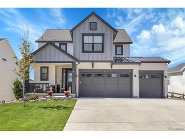 Charming two-story home with a three-car garage and a well-manicured front yard at 1174 Williams Loop, Elizabeth, CO 80107