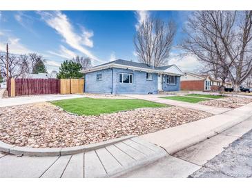 Charming single-story home with blue brick and a well-maintained, low maintenance rock and grass yard at 11367 Fowler, Northglenn, CO 80233