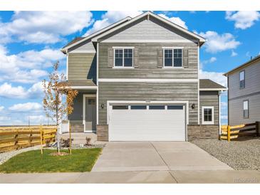Charming two-story home featuring a two-car garage and neutral siding at 17949 Dandy Brush Ln, Parker, CO 80134