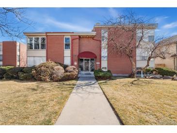 Attractive brick building with a manicured lawn and inviting entrance at 320 S Ames St # 8, Lakewood, CO 80226