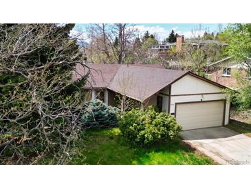 Well-maintained home featuring a two-car garage and mature landscaping in a desirable location at 6463 Brentwood St, Arvada, CO 80004