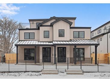 Stunning modern two-story home with a covered porch and black metal accents at 2520 S Cherokee St, Denver, CO 80223