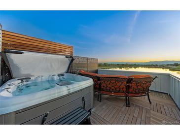 Rooftop deck featuring a hot tub and lounge area with expansive views of the surrounding landscape at 3101 W 47Th Ave # 13, Denver, CO 80211