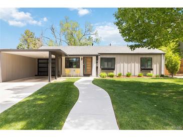 Charming home featuring a well-manicured lawn, modern siding, and covered parking at 3040 S Dexter Way, Denver, CO 80222