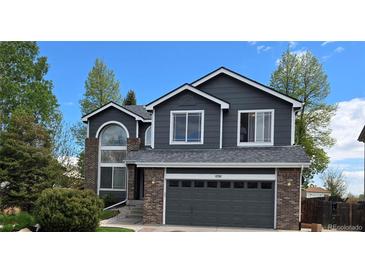 Charming two-story home featuring a brick accent, fresh paint and a two-car garage at 12742 Clermont St, Thornton, CO 80241