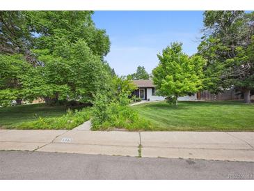 Ranch style home with mature landscaping and a well-manicured lawn at 4360 S Alton Ct, Greenwood Village, CO 80111