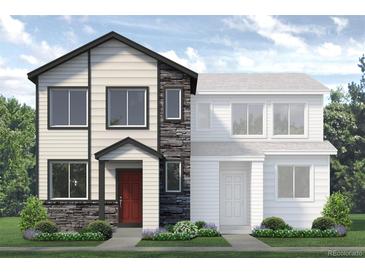 Two-story modern home with stone accents and landscaped yard at 1438 Coral Pl, Longmont, CO 80504