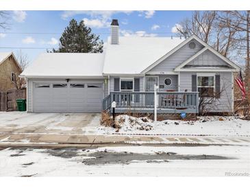 Charming exterior of single Gathering home featuring a quaint front porch and attached garage at 17794 E Bellewood Dr, Aurora, CO 80015