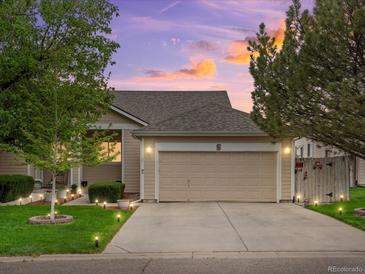 Charming single-Gathering home with well-maintained landscaping and attached two-car garage under a colorful sunset at 8240 Clayton Ct, Denver, CO 80229