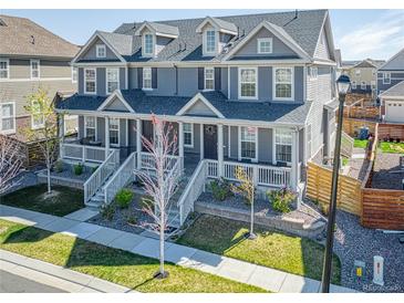 Charming townhome showcasing a well-maintained lawn and inviting front porch at 17614 Cherokee St, Broomfield, CO 80023