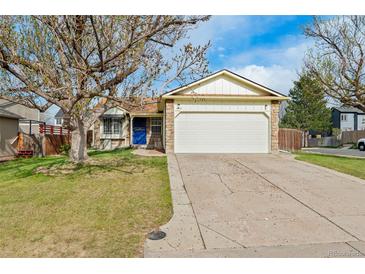 Charming single-Gathering home featuring a two-car garage, stone accents, and a well-manicured lawn at 12116 N Fairfax St, Thornton, CO 80241