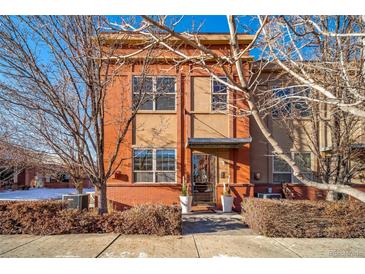 Attractive brick front exterior with landscaping and a welcoming entrance at 7777 E 1St Pl # 110, Denver, CO 80230