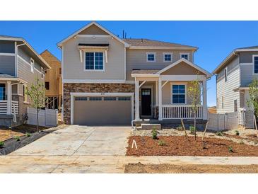Charming two-story home featuring stone accents and a covered front porch at 459 S Salida St, Aurora, CO 80017