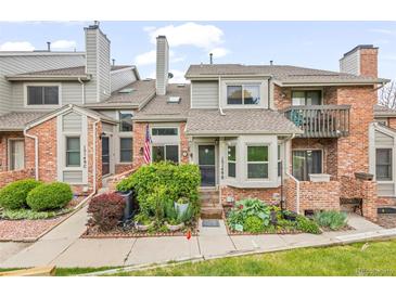 Charming brick townhome with well-maintained landscaping and inviting entrance at 15149 E Princeton Pl # B, Aurora, CO 80014