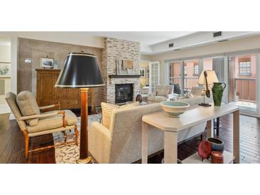 Cozy living room with a fireplace and comfortable seating area at 1512 Larimer St # 39, Denver, CO 80202
