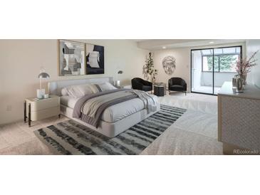 Bright main bedroom boasts a large bed, balcony access, and stylish decor at 7000 E Quincy Ave # 317, Denver, CO 80237