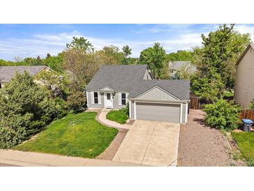 Charming single-Gathering home with a well-manicured lawn and an attached two-car garage in a lovely neighborhood at 904 Clover Cir, Lafayette, CO 80026