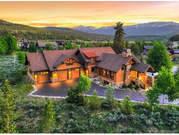 Stunning home with a three-car garage, stone accents, and mountain views at 59 Gold Run Rd, Breckenridge, CO 80424