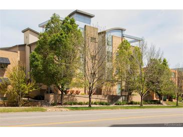 Modern condo building boasting a sleek design and charming landscaping at 2314 S University Blvd, Denver, CO 80210