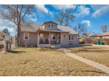 Charming single-Gathering home featuring a welcoming front porch and well-maintained lawn at 1177 Jamaica St, Aurora, CO 80010