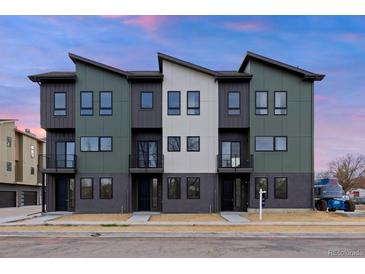 Modern townhome with multiple units featuring a contemporary design and exterior color scheme at 5187 Carr St, Arvada, CO 80002